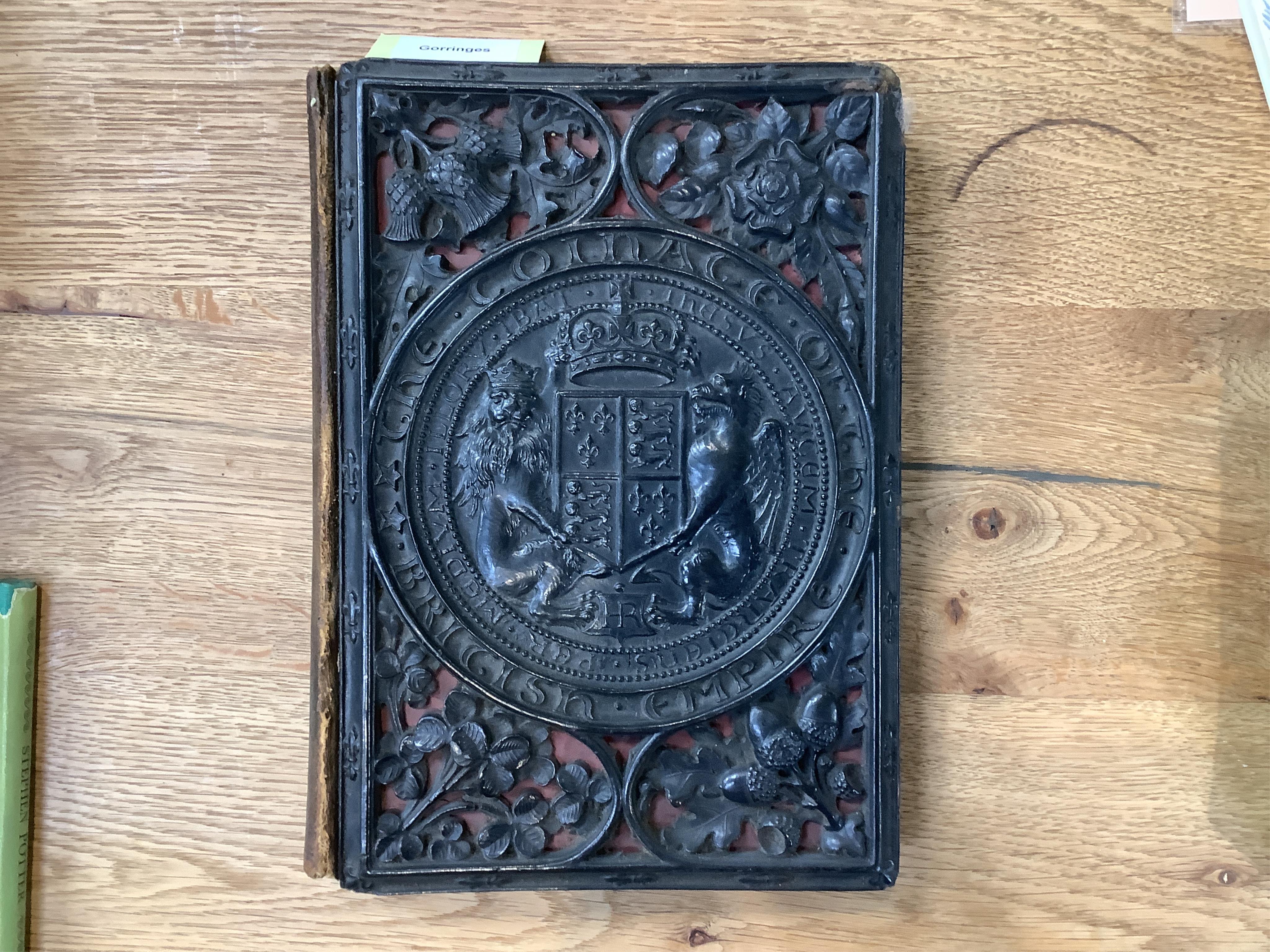 Humphreys, Henry Noel. The coinage of the British Empire. London, 1863. 8vo, 24 plates, papier maché binding with royal coat of arms in relief, original leather spine